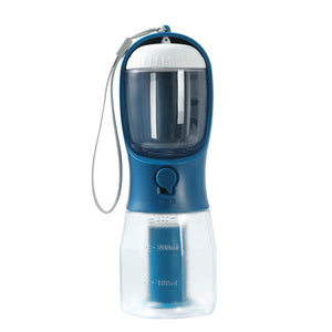 Blue and clear portable pet water bottle with measurement markings on a white background