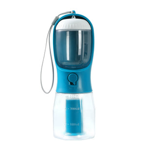 Blue and clear portable pet water bottle with a strap on a white background