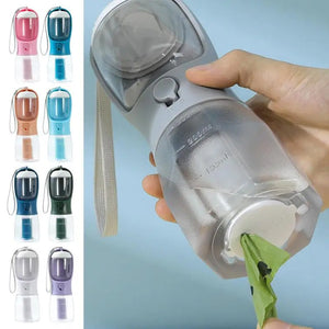 Portable pet water bottle with a hand holding it, showing different color options on the left.