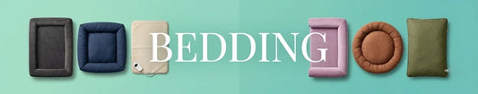 Dog beds, pillows, and blankets arranged on a sage green background, labeled BEDDING.