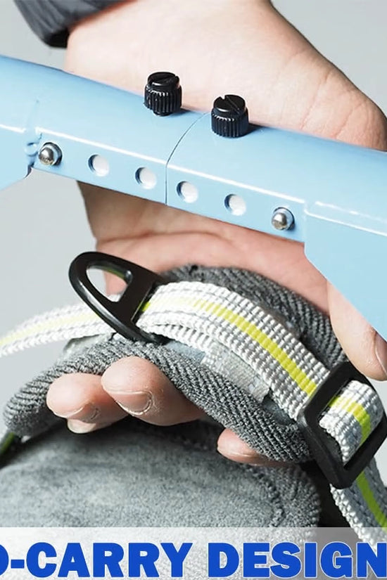 FrontRise Pro wheelchair frame folded and carried by hand, showing its lightweight, portable hand-carry design.